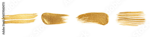 Four gold paint brush strokes and texture patterns isolate metallic abstract