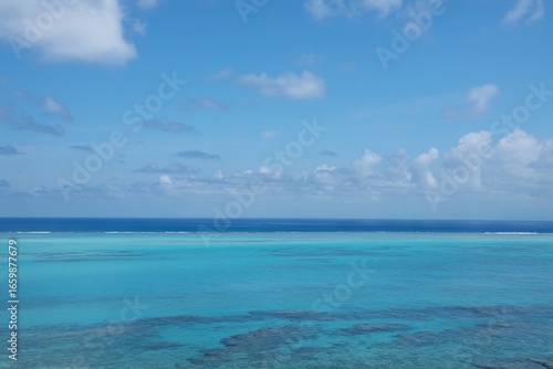Wallpaper Mural Calm turquoise ocean under blue sky with clouds, tropical seascape horizon, travel and summer background. Torontodigital.ca