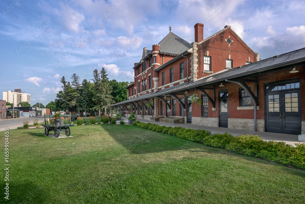 Fototapeta premium Exterior of the historic brick and limestone train station in the town of Dauphin, Manitoba, Canada