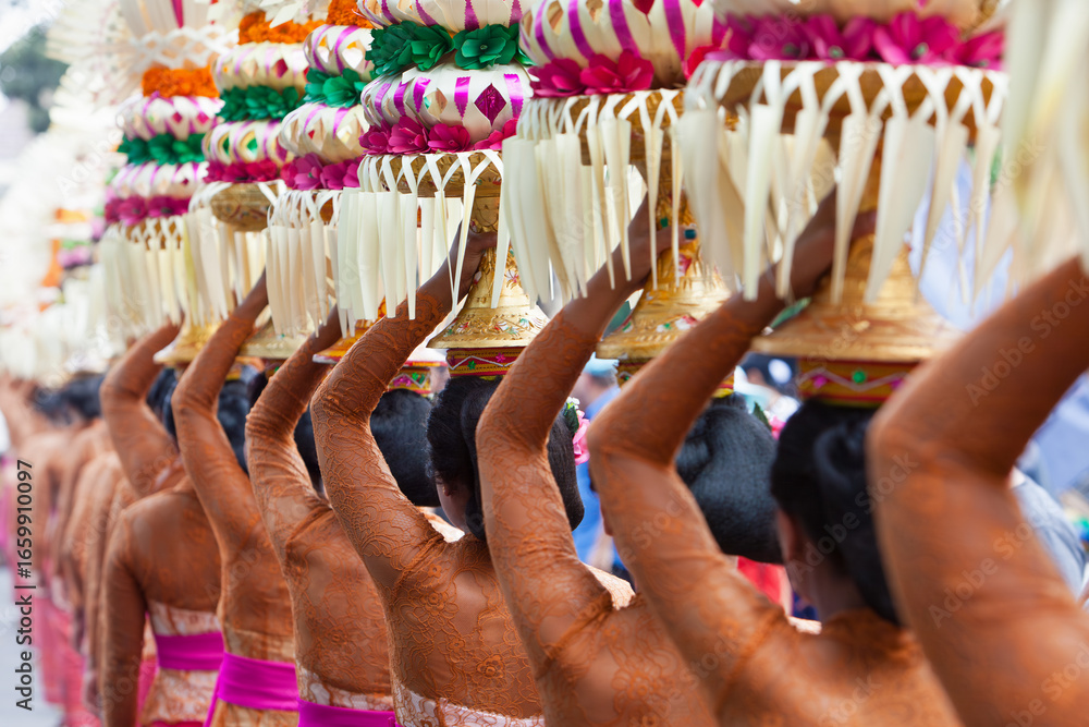 © Tropical studio - Procession of beautiful Balinese women in traditional costumes - sarong, carry offering on heads for Hindu ceremony. Arts festival, culture of Bali island and Indonesia people, Asian travel background © Tropical studio - Procession of beautiful Balinese women in traditional costumes - sarong, carry offering on heads for Hindu ceremony. Arts festival, culture of Bali island and Indonesia people, Asian travel background