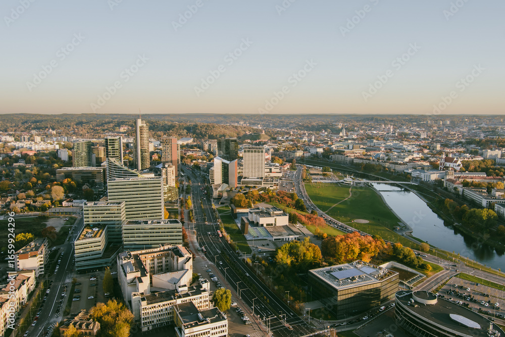 Obraz premium Beautiful Vilnius city panorama in autumn with orange and yellow foliage. Fall city scenery in Vilnius, Lithuania