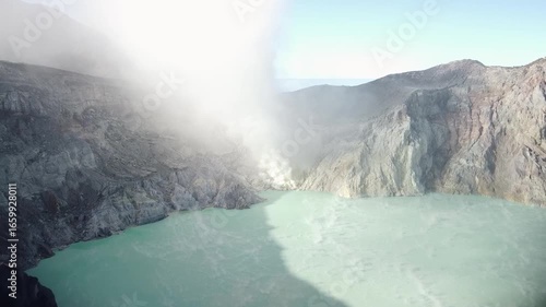 Drone Flying Fast Toward Kawah Ijen Crater Lake and Smoke