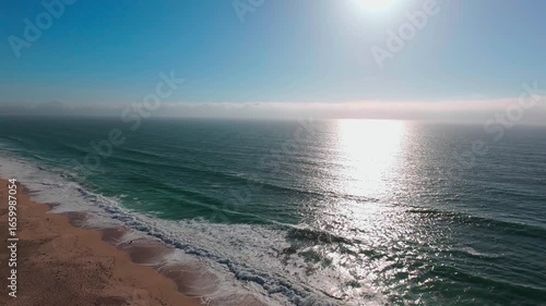 Monterey Bay Ocean Aerial — Beautiful drone shot of the sun sparkling on the Pacific Ocean with a sandy coastline