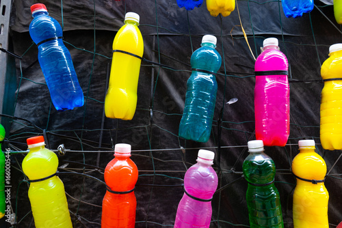 Plastic bottles filled with colored liquid