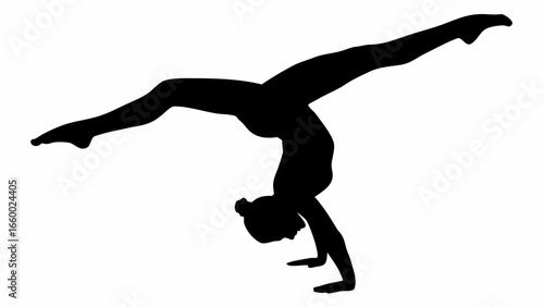 Silhouette of a gymnast performing a handstand with legs split in the air in a dynamic pose and balance