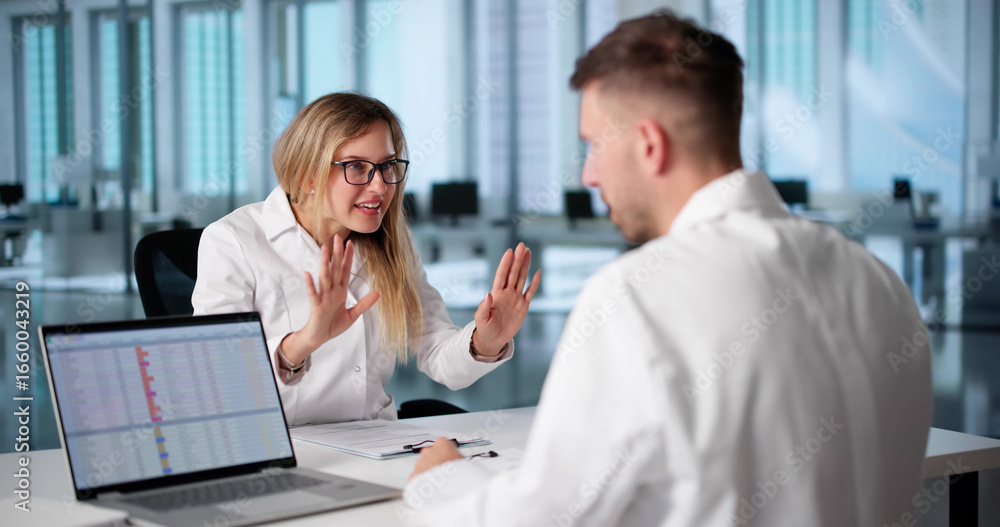 Fototapeta premium Doctors Argue Over Treatment Plan During Hospital Staff