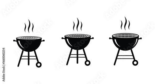 Three black barbecue grills with smoke rising from them in a row