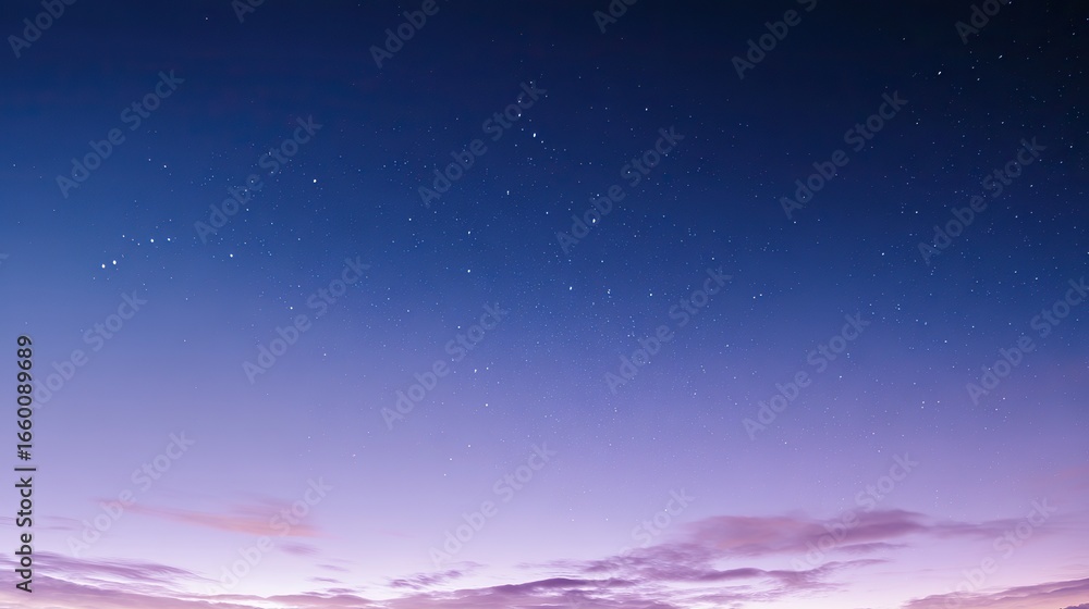 Fototapeta premium Beautiful cloudless night sky with stars and soft blue-purple gradient, captured in panorama with wide angle and long exposure at sunset, boasting high resolution and a peaceful atmosphere.