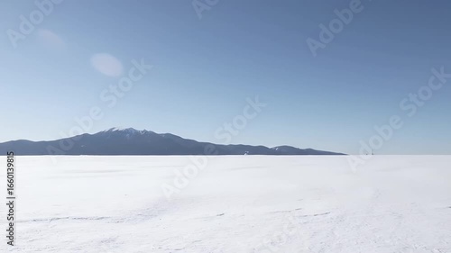 Wallpaper Mural Vast Expanse of Snowy Plains Under a Clear Blue Sky with Distant Mountains Torontodigital.ca