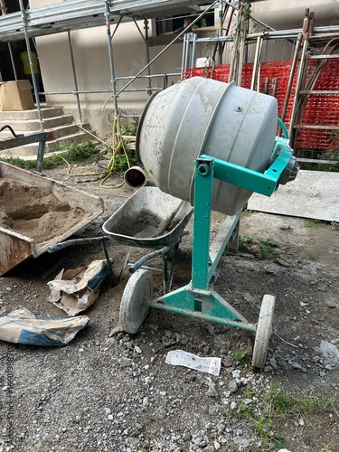 Wallpaper Mural Cement mixer with fresh concrete and wheelbarrow at construction site Torontodigital.ca