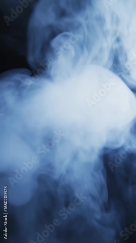 Ethereal Blue Smoke Swirls and Wisps Dance in Moody, Atmospheric Lighting