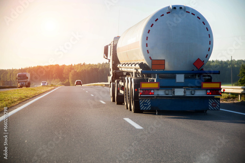 Wall Mural A truck tractor with a tank semi-trailer is transporting a hazardous flammable cargo - fuel