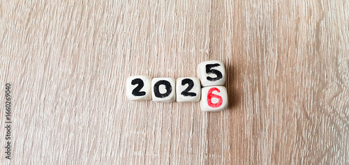 2025-2026 on wooden cubes, change of year, goal, business planning.
