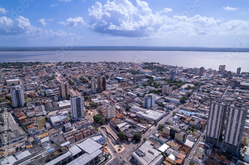 Beautiful aerial view of the city of Belém with the Amazon River in the background. Headquarters of the UN Climate Change Conference Cop30, Pará, Brazil. Concepts include environment, ecology, nature.