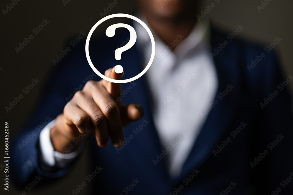 African Businessman drawing glowing question mark. Concept for help, support, and information. Frequently asked questions. FAQs. African Businessman drawing glowing question mark. Concept for help, support, and information. Frequently asked questions. FAQs.