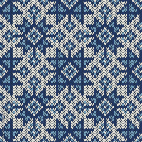 Snowflakes jacquard knitted seamless pattern. Winter background sweater or any knitwear design.  Vector illustration.