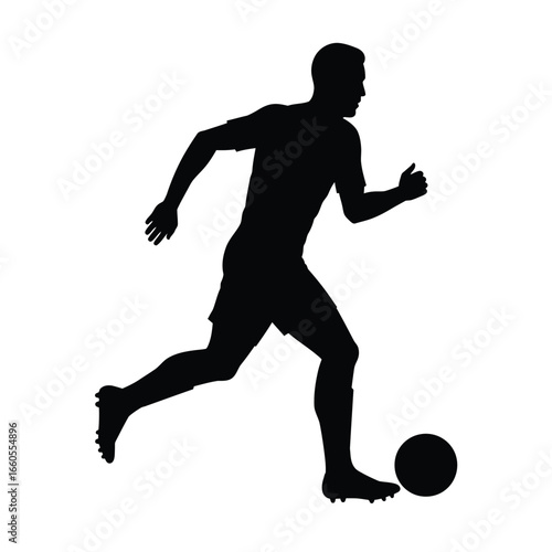 Silhouette of soccer player kicking ball black white