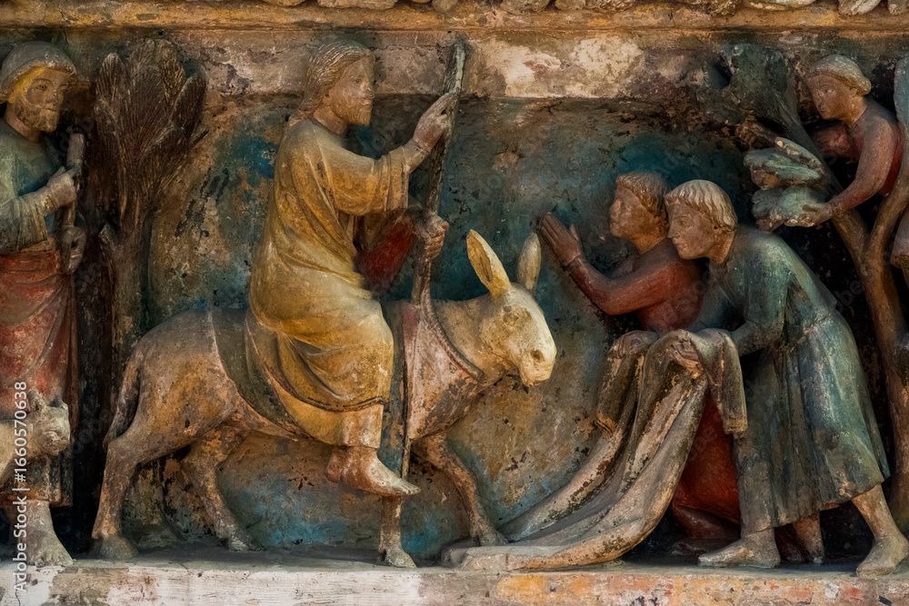 Naklejka premium Jesus enters Jerusalem on a donkey, welcomed with palm branches