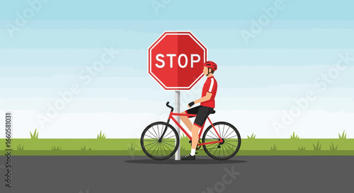 Cyclist Pauses at a Stop Sign on an Open Road for Road Safety