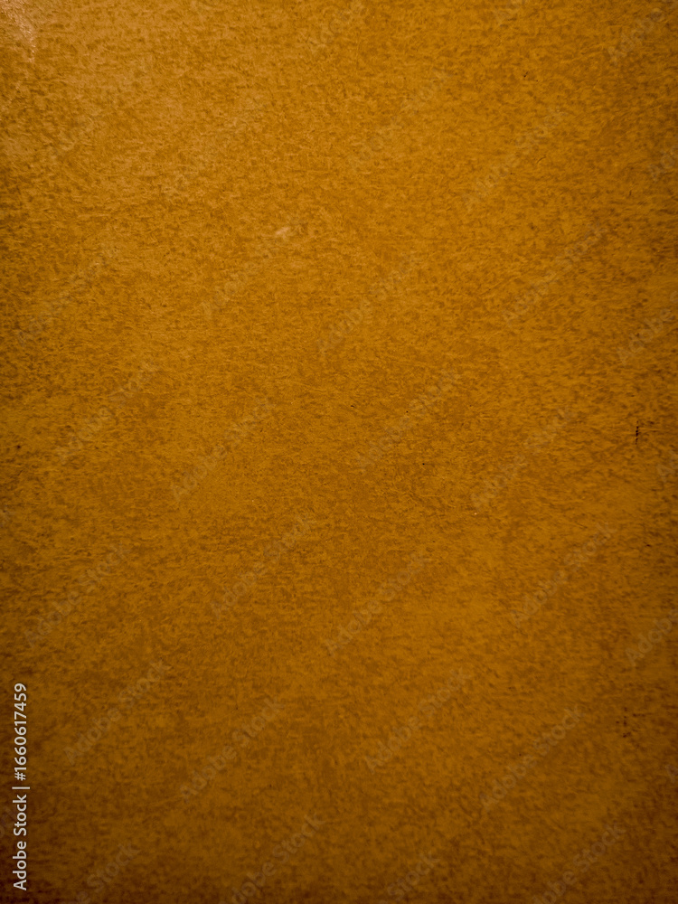 Fototapeta premium Textured orange paper background with subtle pattern
