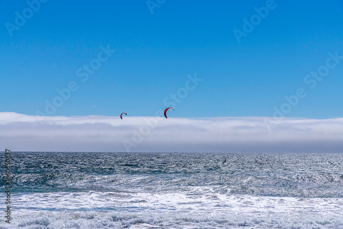 Lompoc, CA, USA – August 13, 2025: Kitesurfers take advantage of the high winds on the Pacific Ocean at Jalama Beach in Lompoc, CA.