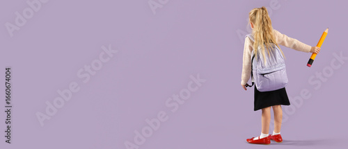 Cute little schoolgirl with...