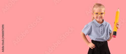 Cute little schoolgirl with...