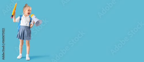 Cute little schoolgirl with...