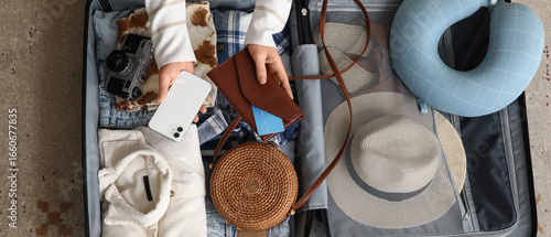 Young woman unpacking her s...