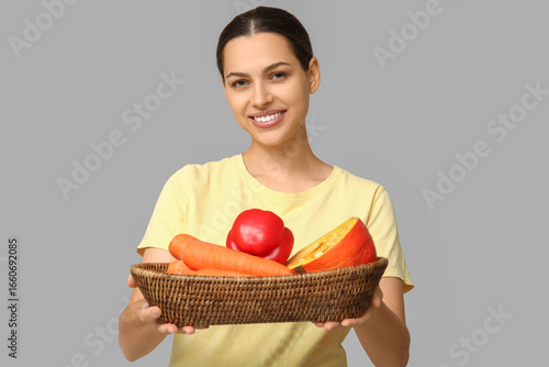 Pretty young woman holding ...
