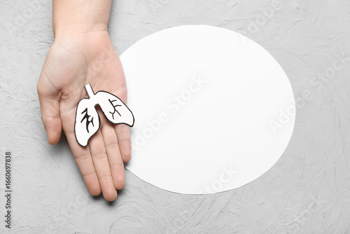 Female hand with paper lung...