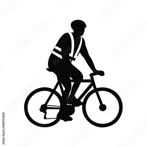 Silhouette of cyclist wearing safety vest