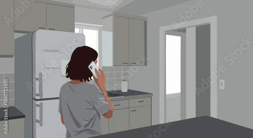 Woman using smartphone in modern kitchen interior with gray tones and natural light 