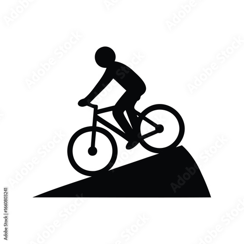 silhouette of a man riding a bike