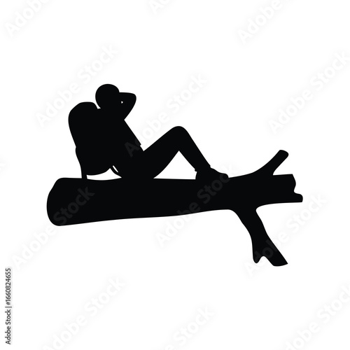 Silhouette of Hiker Resting on Fallen Log Relaxing in Nature