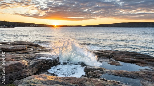 Acadia National Park sunrise over the Atlantic Ocean with waves crashing ashore on the rocky coast