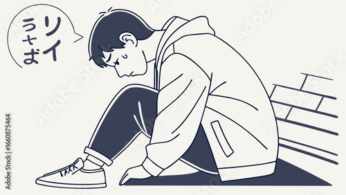 Sad young man sitting alone on ground.