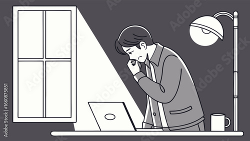 Man working on laptop at home office.