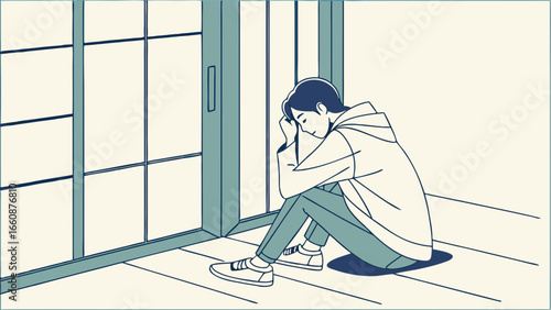 A person sitting alone in a room feeling sad and depressed.