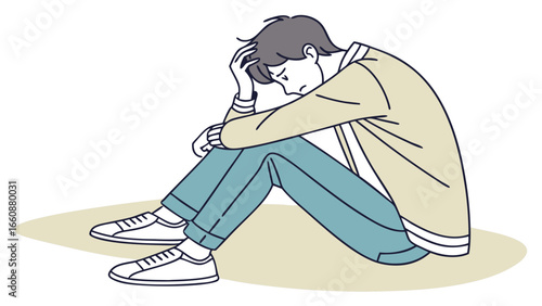 A man sitting alone feeling sad.