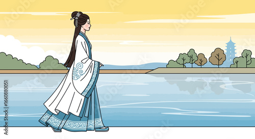 Elegant woman in traditional Chinese attire strolls along a serene lakeside at sunset.