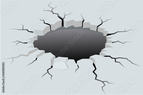 A large hole with cracks in a surface broken and damaged area visible