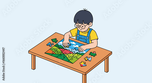 A young boy with glasses sits at a table, focused on assembling a colorful jigsaw puzzle depicting a landscape scene.