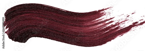 A swath of deep burgundy paint or cosmetic product, applied with a brush, is displayed against a white background
