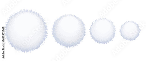 Set of four white fluffy pom poms in different sizes