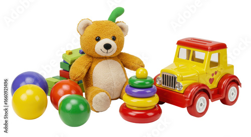 Colorful childrens toys including a teddy bear stacking rings and a toy truck isolated on white background