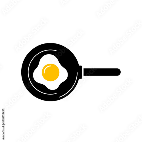 Fried egg cooking in a black frying pan.