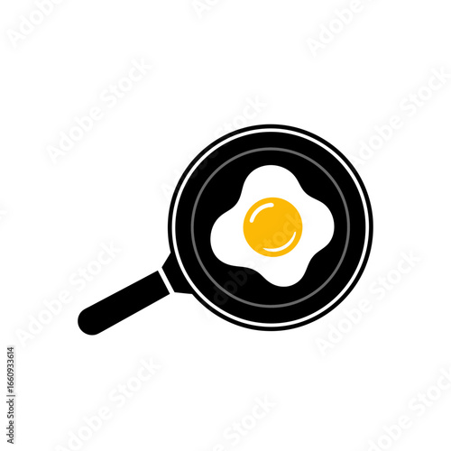 Fried egg cooking in a black frying pan.