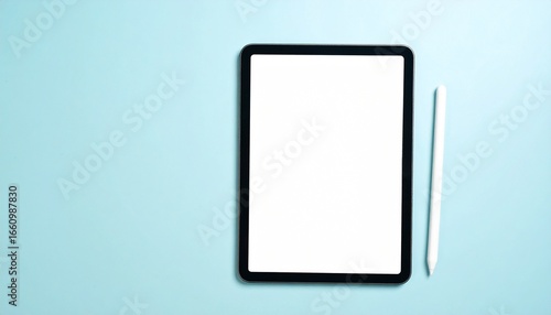 Modern Digital Tablet with Pristine Blank Screen and Sleek Stylus on Calming Blue Background for Content and Design