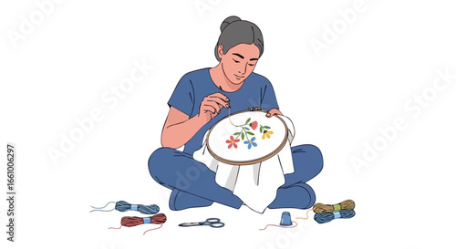 Focused hobbyist engrossed in the art of embroidery crafting a beautiful floral design with precision and creative flair in her tranquil space